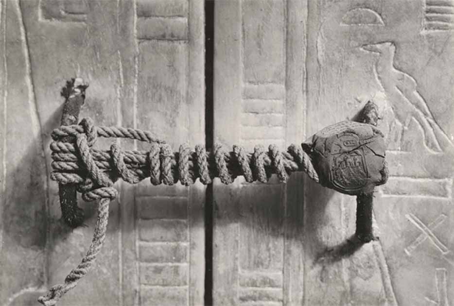 The intact necropolis seal and cord fastening on the third (of four) great gilded shrines surrounding Tutankhamun's sarcophagus in the burial chamber. The unbroken seal confirmed that the king's body remained undisturbed, despite the tomb having been broken into and robbed several times in antiquity. (Public domain)