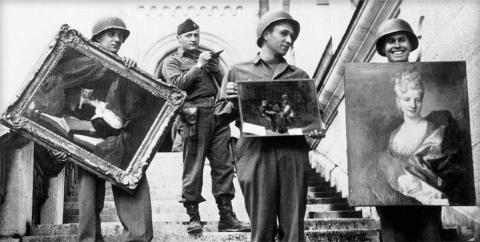 MFAA Officer James J. Rorimer supervises U.S. soldiers recovering looted paintings from Neuschwanstein Castle in Germany. Source: Public domain