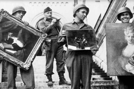 MFAA Officer James J. Rorimer supervises U.S. soldiers recovering looted paintings from Neuschwanstein Castle in Germany. Source: Public domain
